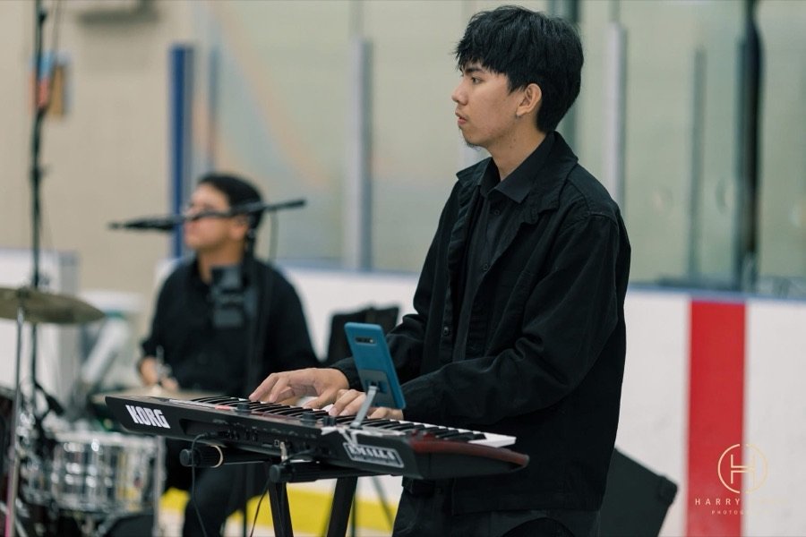 Keyboardist performing with the band