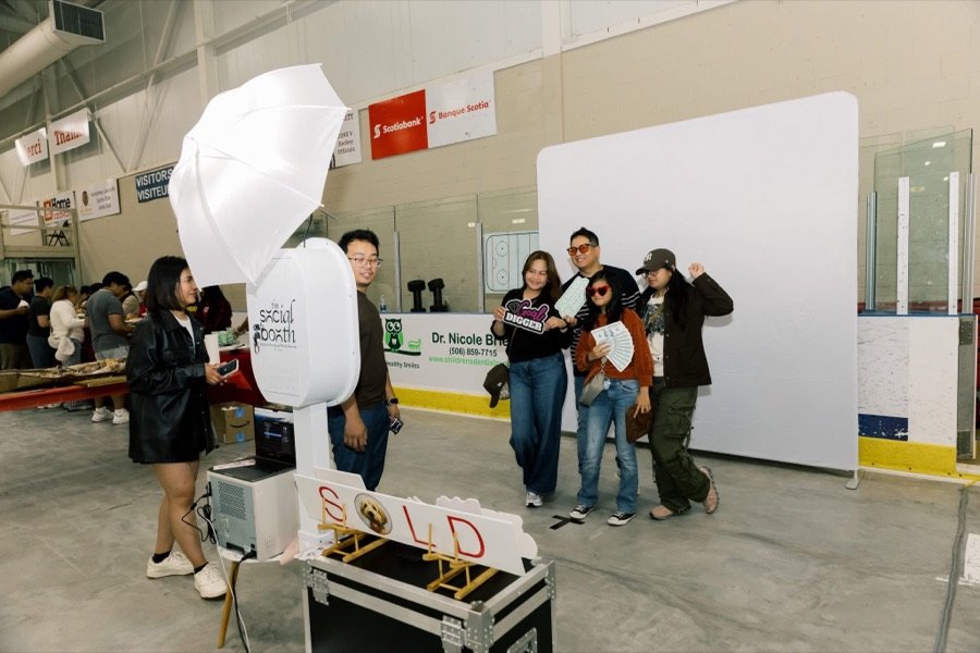 Guests posing at the photo booth